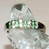 Vit grön cubic zirkonia smycke ring platerad gold storlek 8,5.

2 rader med gnistrande cubic zirkonia stenar. Mycket snygg ring.

